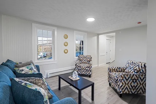 a view of room with wooden floor