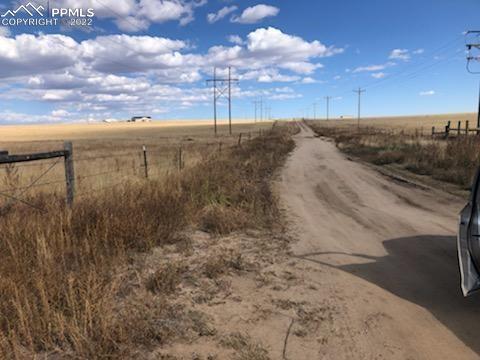 0 Berndt Road Yoder, CO 80864 - Photo 3 of 6 a view of a dry yard with wooden fence