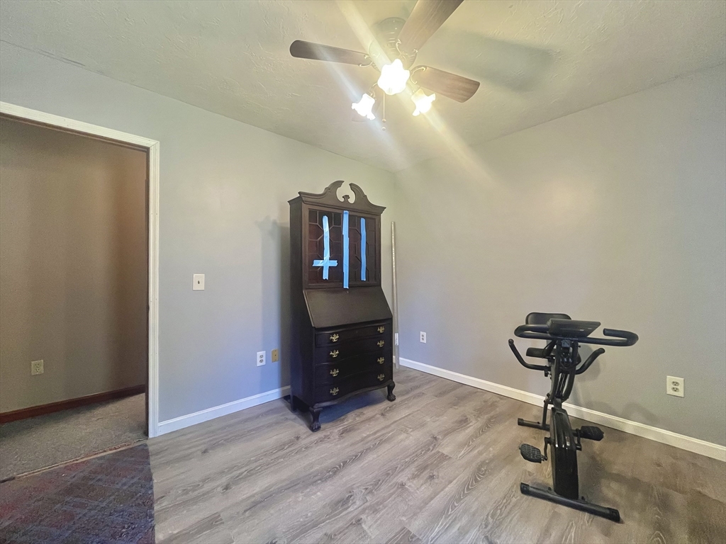 31 Putnam Road Sturbridge, MA 01566 - Photo 16 of 34 a room with furniture and wooden floor