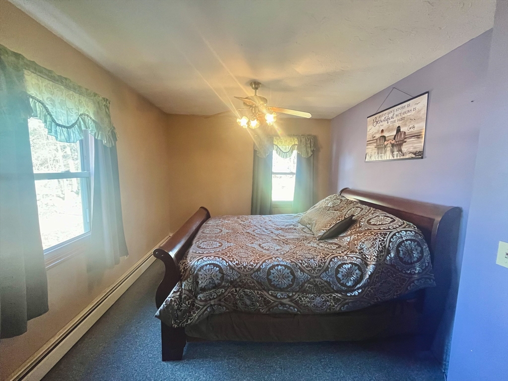 31 Putnam Road Sturbridge, MA 01566 - Photo 20 of 34 a bed sitting in a bedroom next to a window
