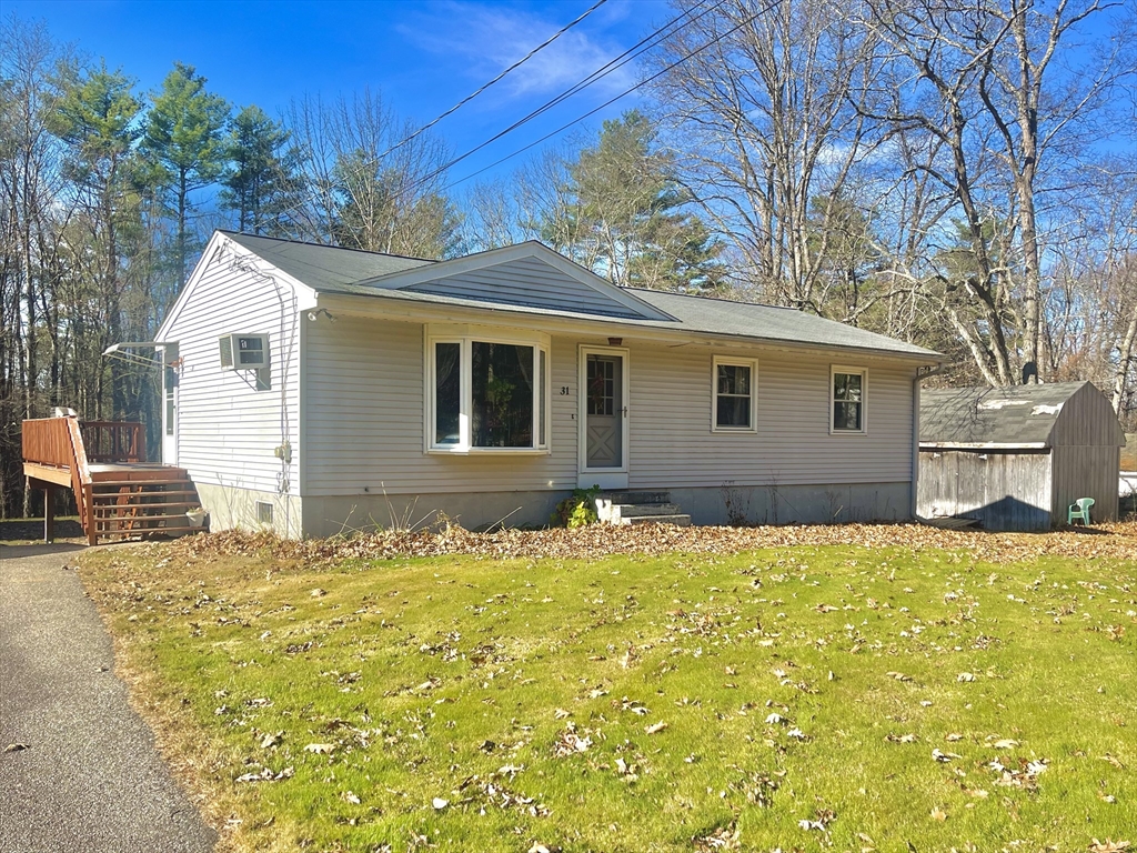 31 Putnam Road Sturbridge, MA 01566 - Photo 2 of 34 a house with yard in front of it