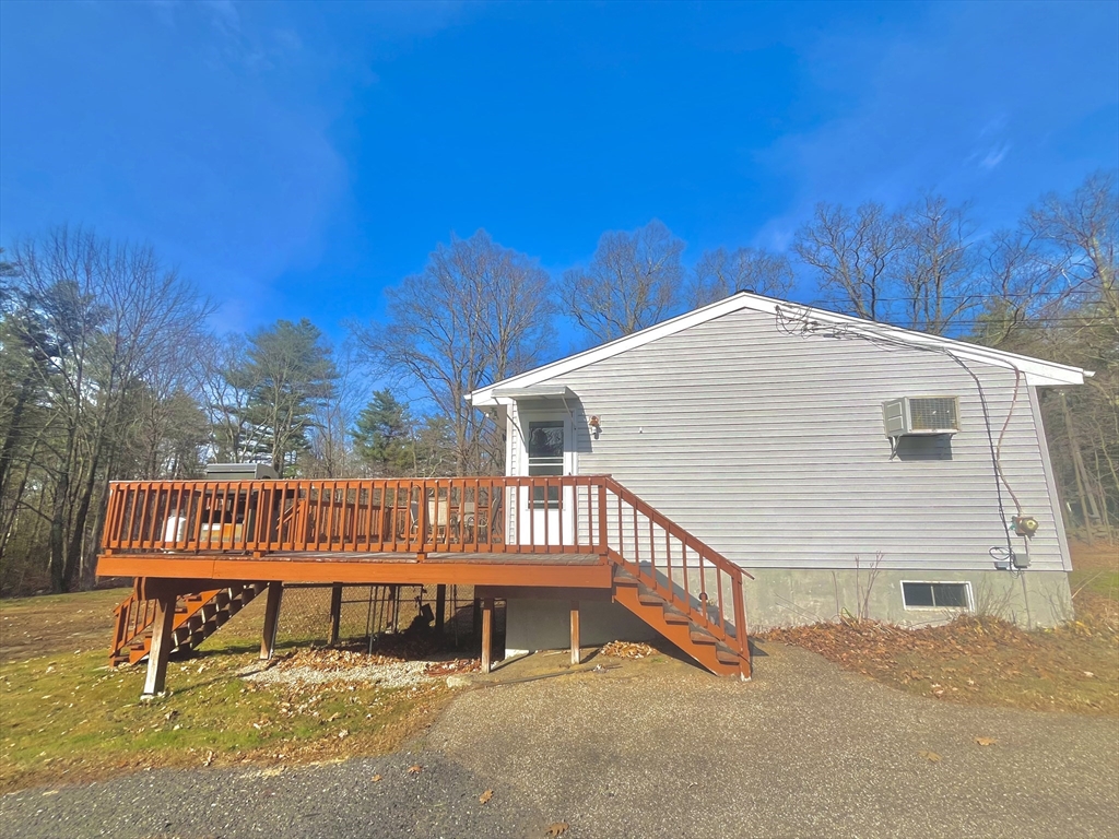 31 Putnam Road Sturbridge, MA 01566 - Photo 25 of 34 a view of a house with a wooden deck