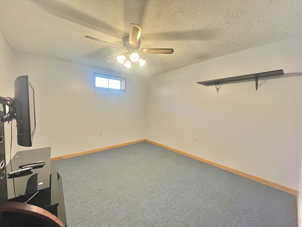 31 Putnam Road Sturbridge, MA 01566 - Photo 33 of 34 a view of a hallway with a chandelier