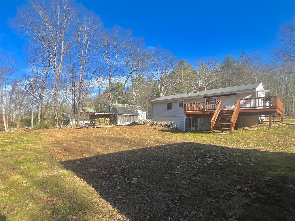 31 Putnam Road Sturbridge, MA 01566 - Photo 4 of 34 a front view of house with yard and trees