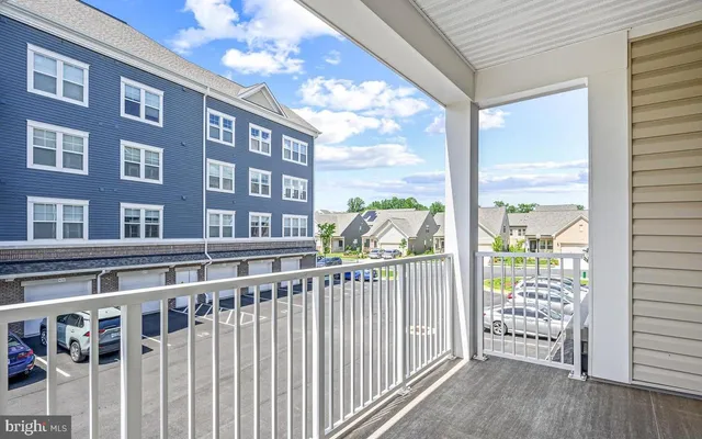 a view of a large building from a balcony