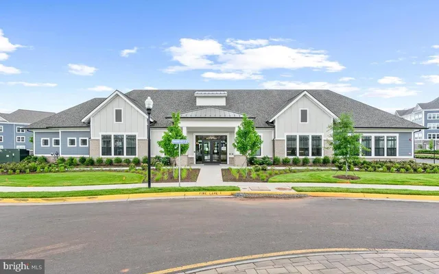 a front view of a house with a yard and porch