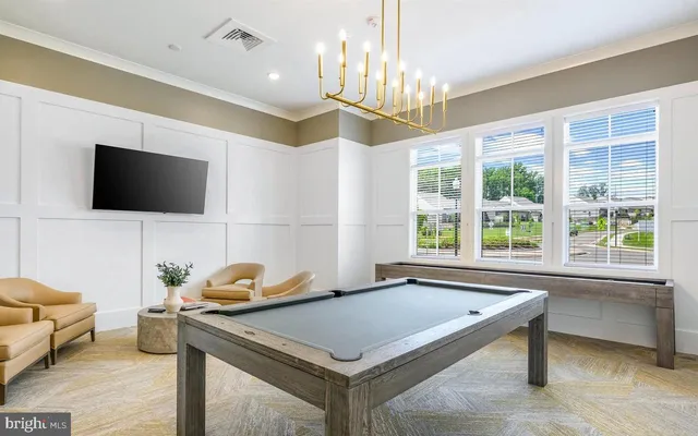 a room with furniture and a flat screen tv