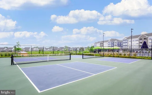 a view of an outdoor space and tennis court