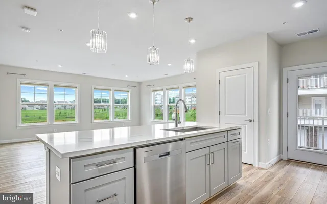 a kitchen with center island and windows