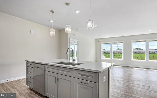 a kitchen with center island and windows