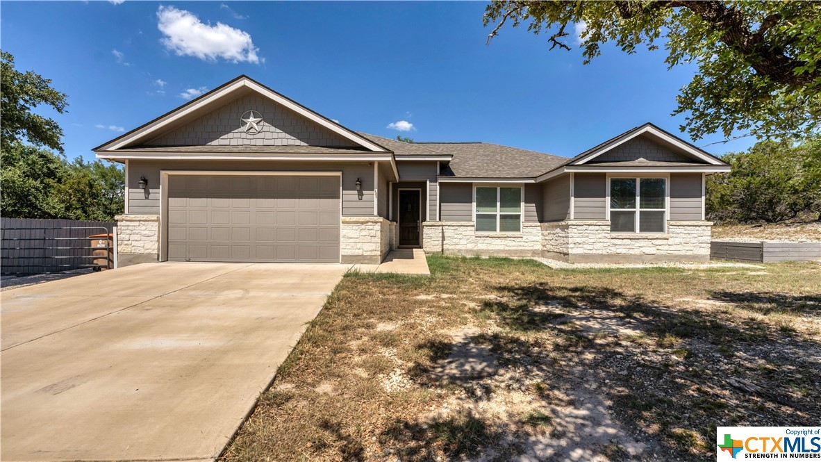 1041 Madrone Road Fischer, TX 78623 - Photo 1 of 1 a front view of a house with a yard