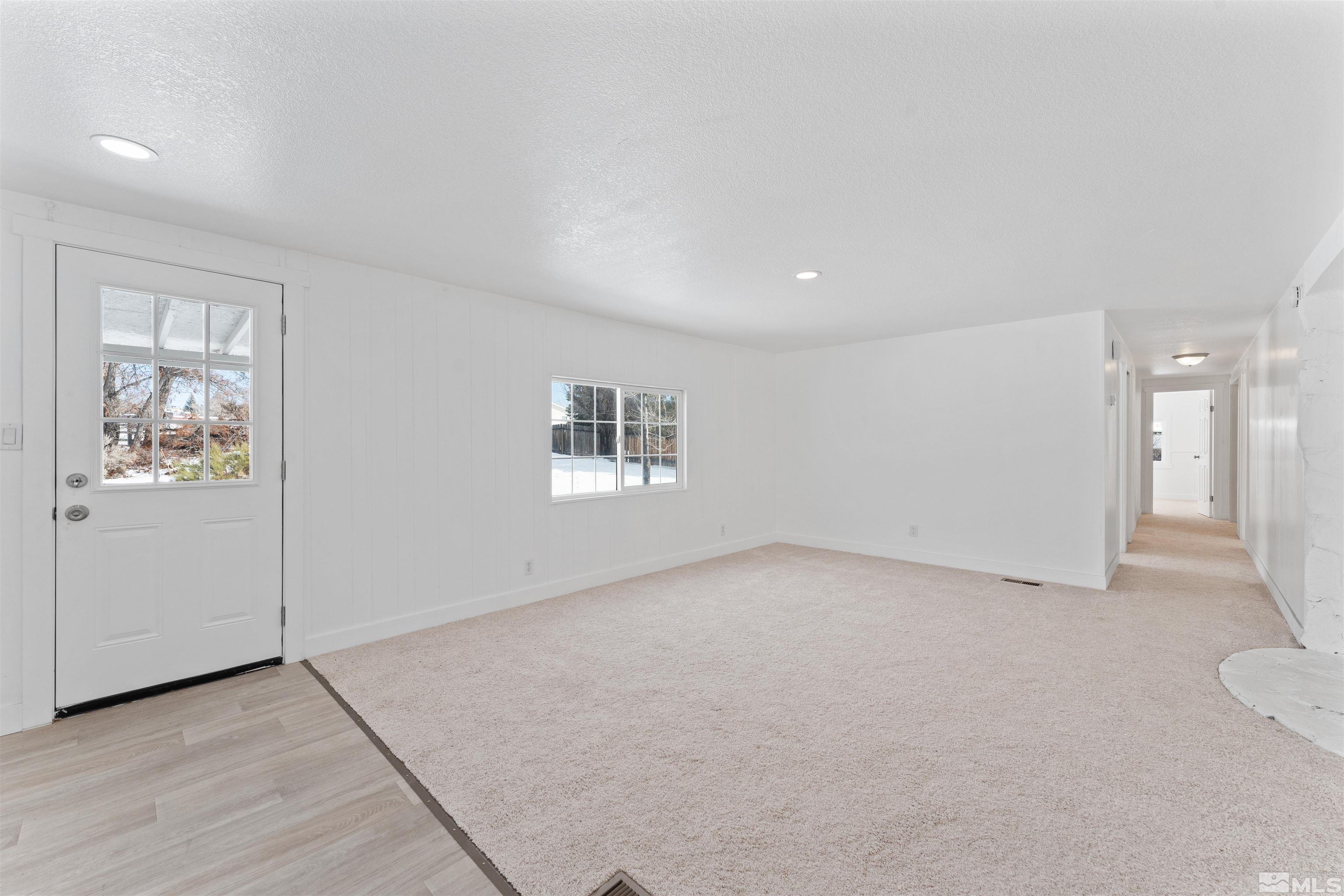 3993 Kiwi Court Reno, NV 89508 - Photo 14 of 39 an empty room with a empty space and windows