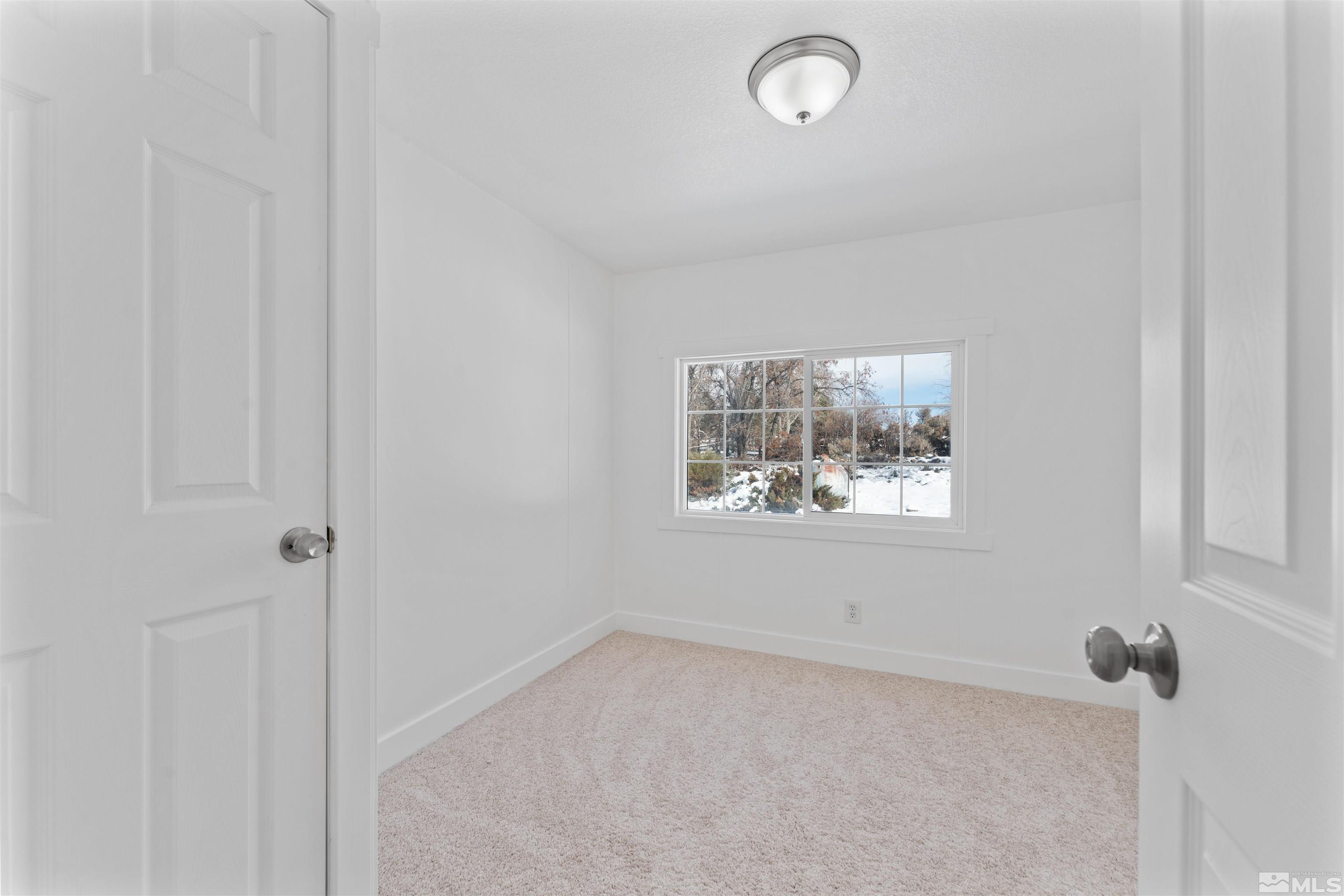 3993 Kiwi Court Reno, NV 89508 - Photo 18 of 39 an empty room with a window