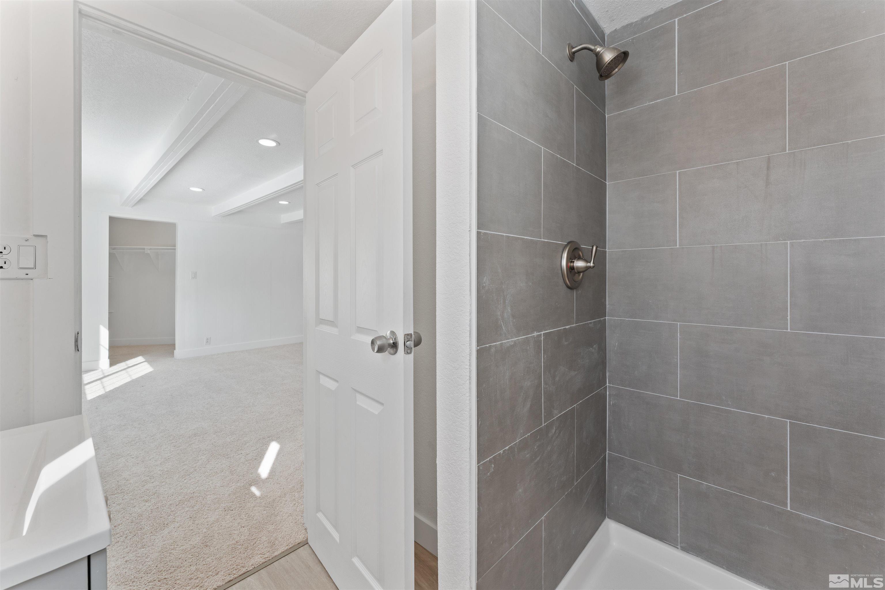 3993 Kiwi Court Reno, NV 89508 - Photo 24 of 39 a bathroom with a shower