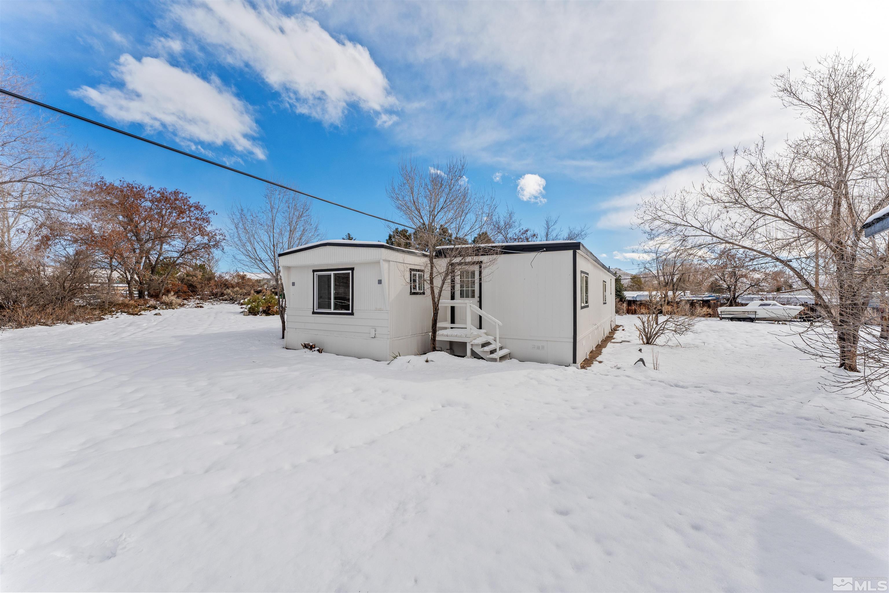 3993 Kiwi Court Reno, NV 89508 - Photo 37 of 39 a view of a house with a snow in the yard