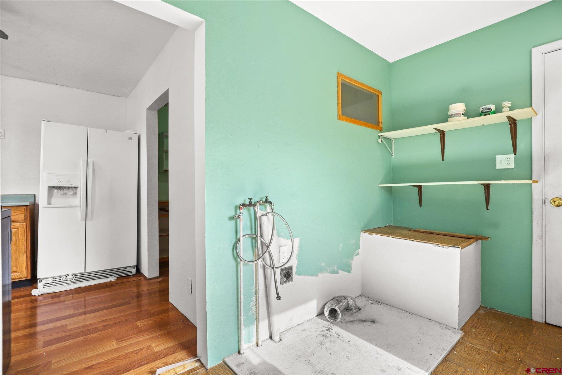 403 East 3rd Street Cortez, CO 81321 - Photo 13 of 31 a bathroom with a toilet and a mirror