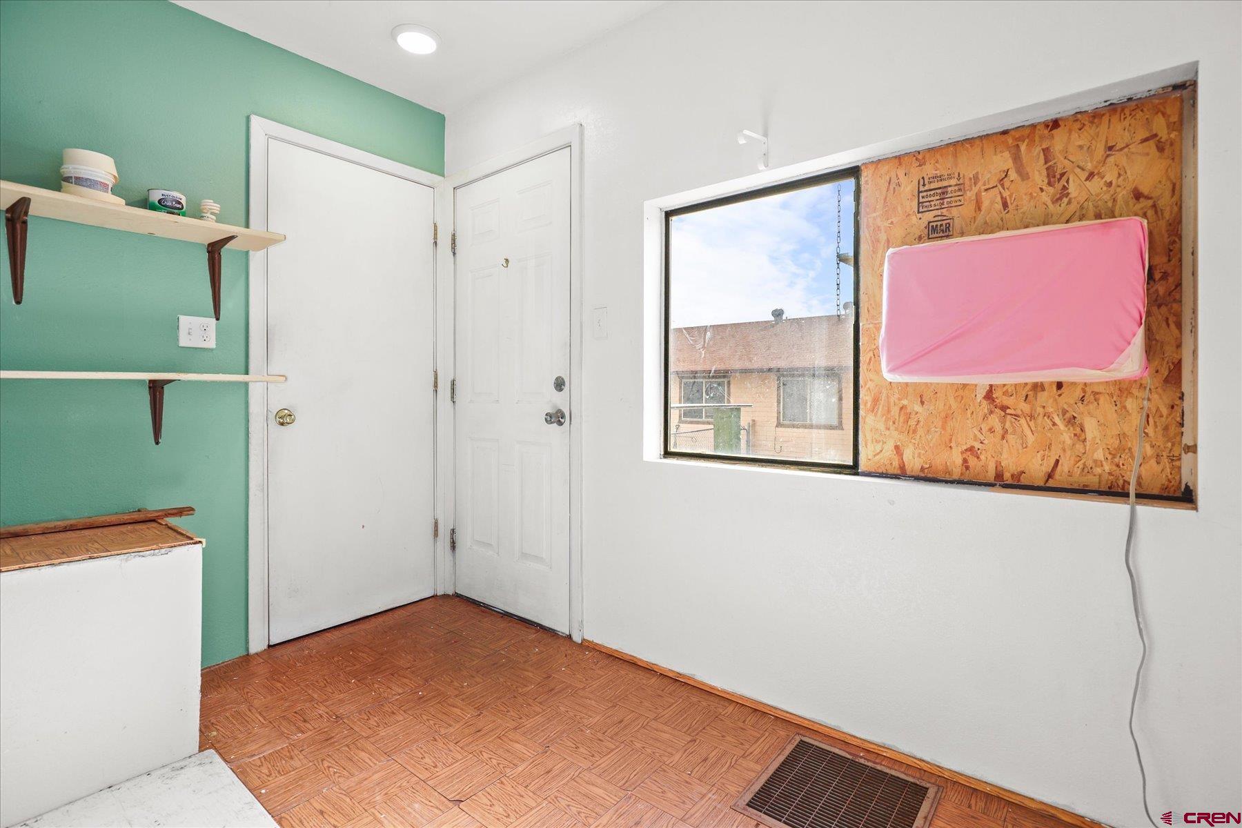 403 East 3rd Street Cortez, CO 81321 - Photo 14 of 31 a view of a hallway with paintings on the wall