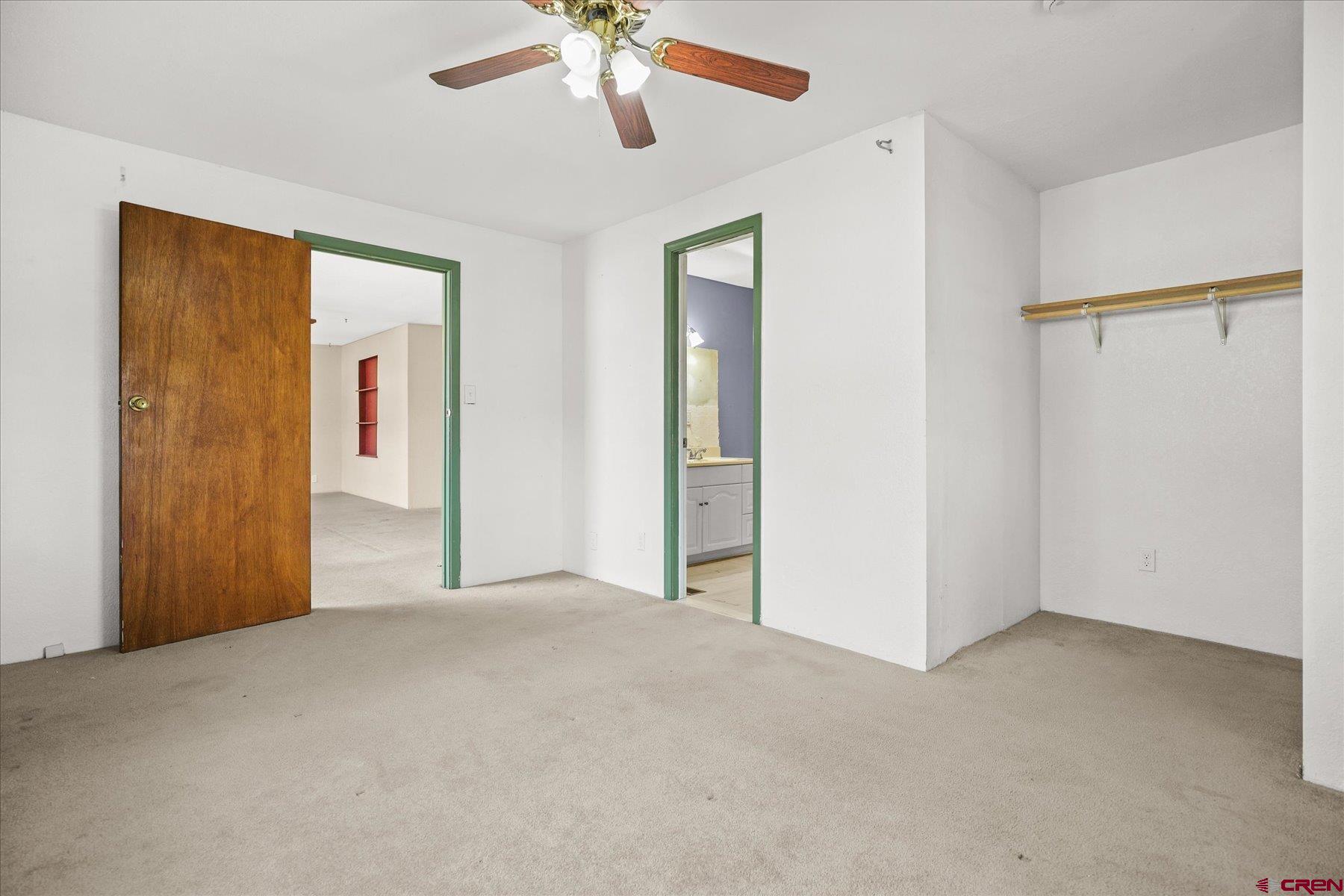 403 East 3rd Street Cortez, CO 81321 - Photo 16 of 31 a view of an empty room with a ceiling fan