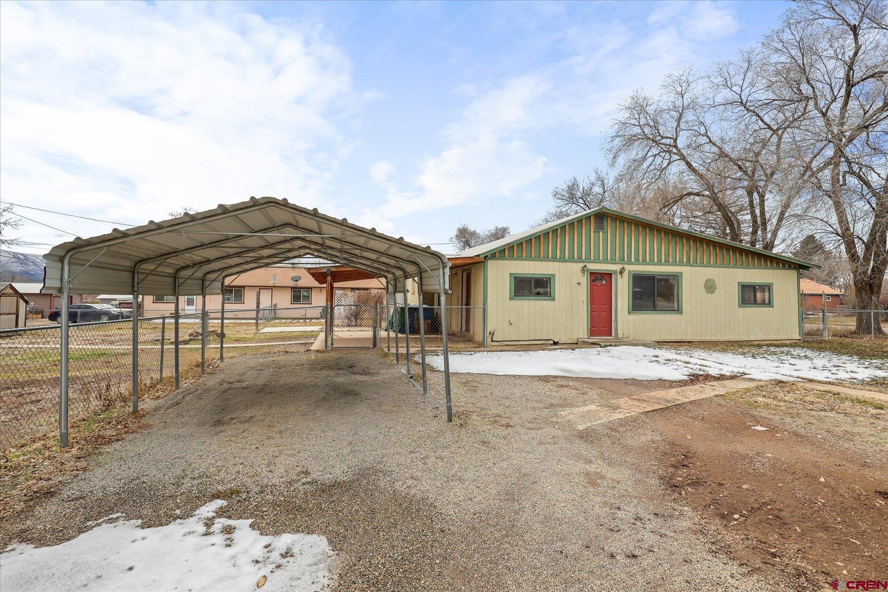 403 East 3rd Street Cortez, CO 81321 - Photo 2 of 31 a view of a house with a yard