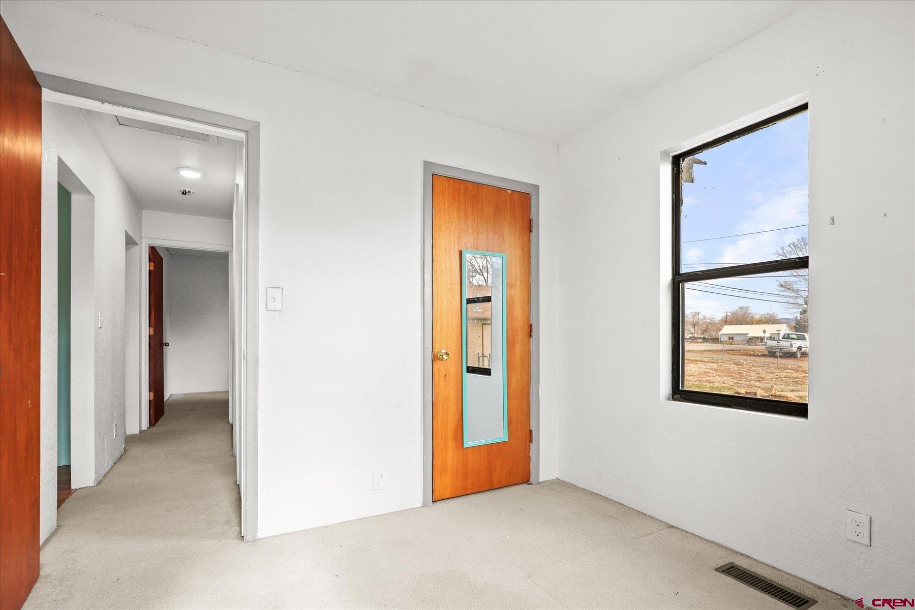 403 East 3rd Street Cortez, CO 81321 - Photo 21 of 31 a view of an empty room with closet and a bathroom