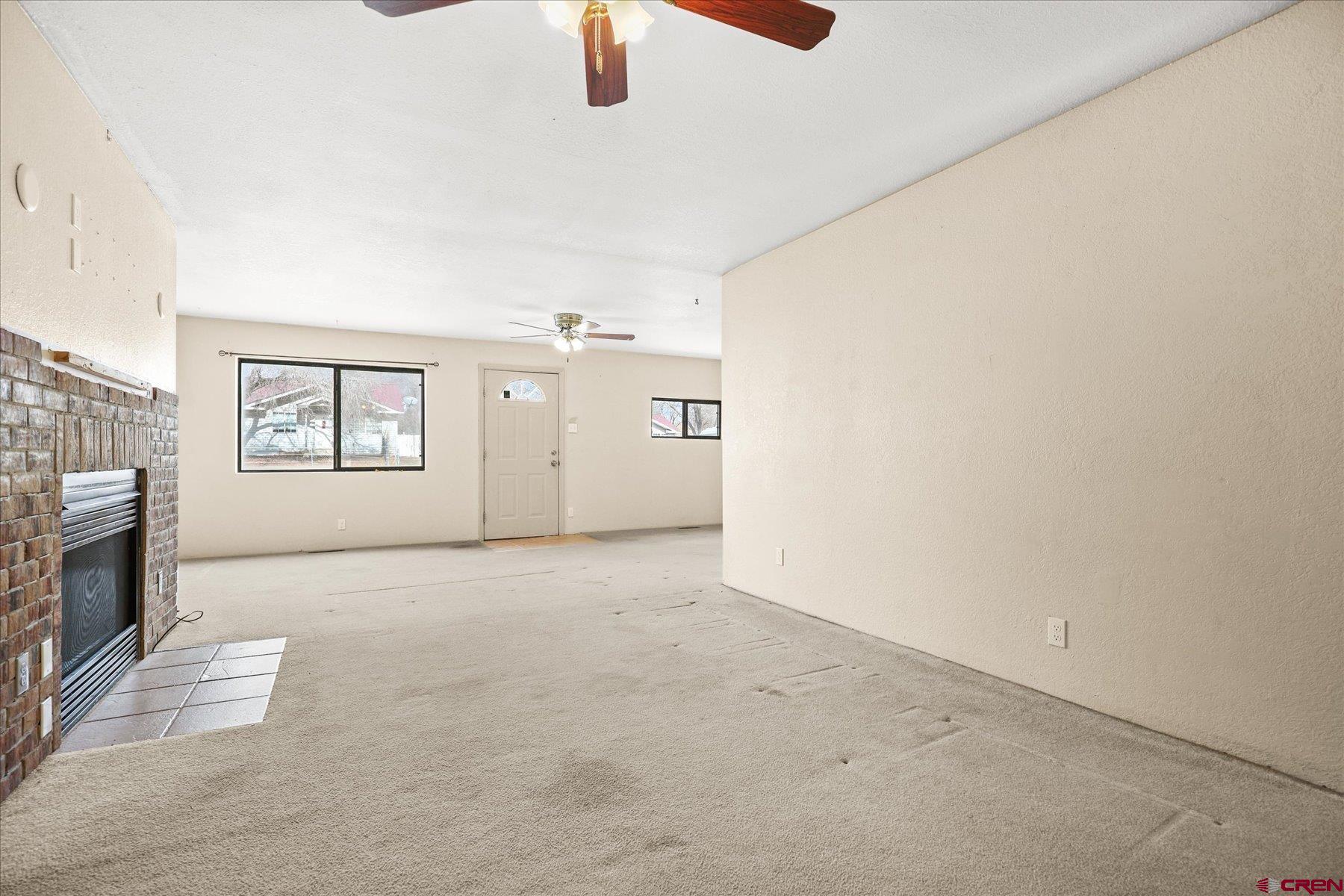 403 East 3rd Street Cortez, CO 81321 - Photo 7 of 31 a view of a livingroom with a fireplace