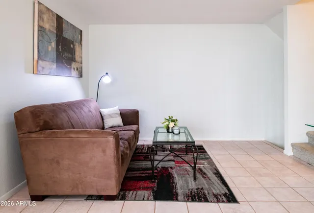 a bathroom with a sink vanity mirror and toilet
