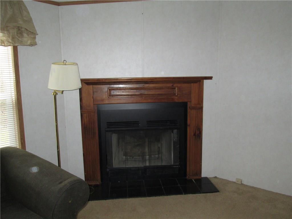 431 B School Road Clinton, PA 15026 - Photo 5 of 25 Wood burning fireplace in the living room.