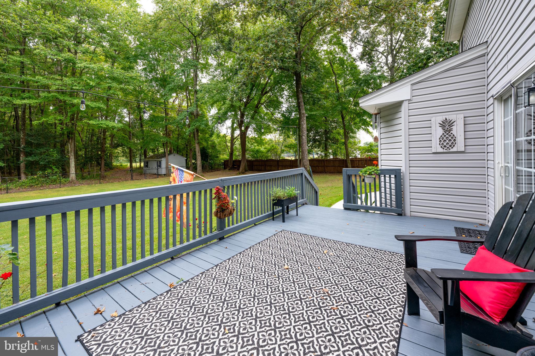 26585 Quantico Creek Road Hebron, MD 21830 - Photo 40 of 58 Deck off the Family Room w/ room to Grill & Chill!