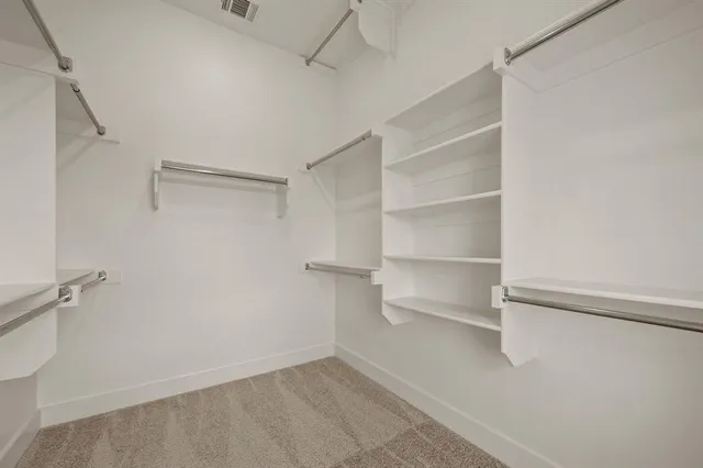 a view of an empty walk in closet