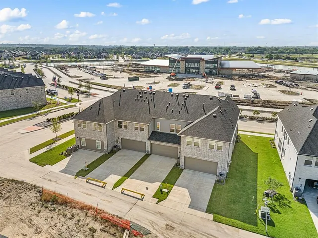 an aerial view of a house with a ocean view