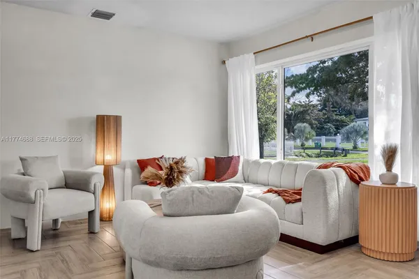 a living room with furniture and a couch