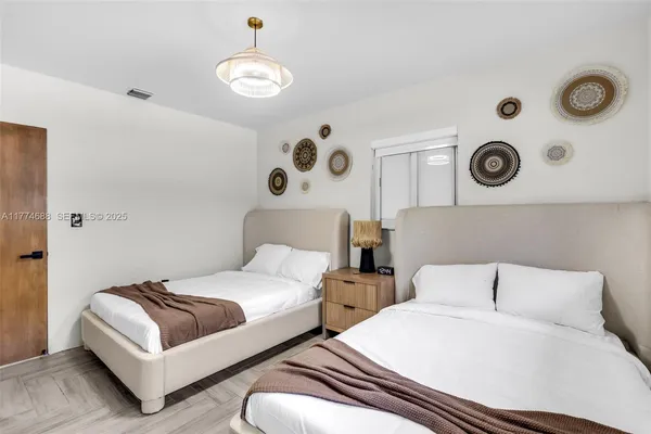 a bedroom with a bed and window