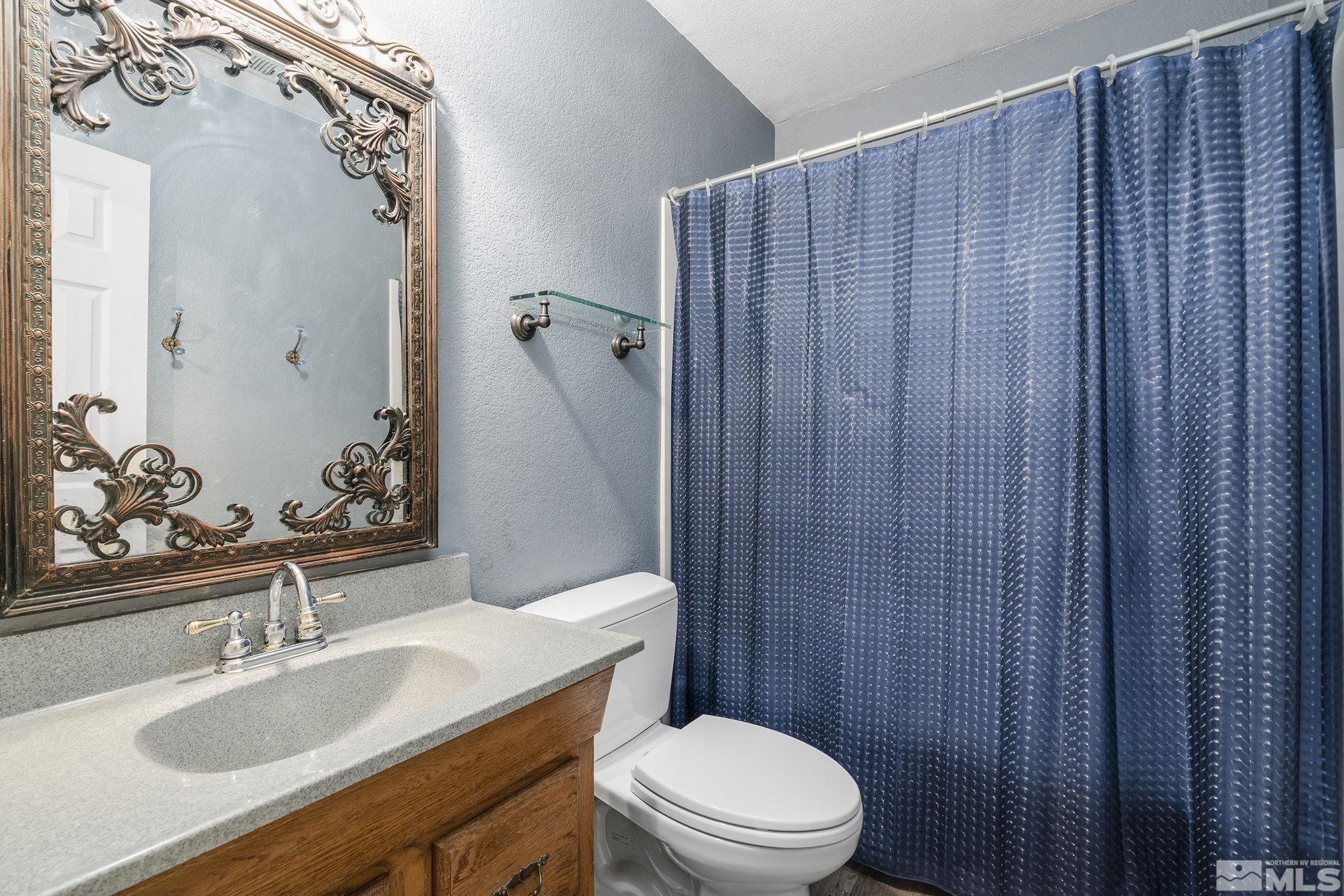 2000 Keystone Avenue Reno, NV 89503 - Photo 12 of 19 a bathroom with a sink a toilet and shower