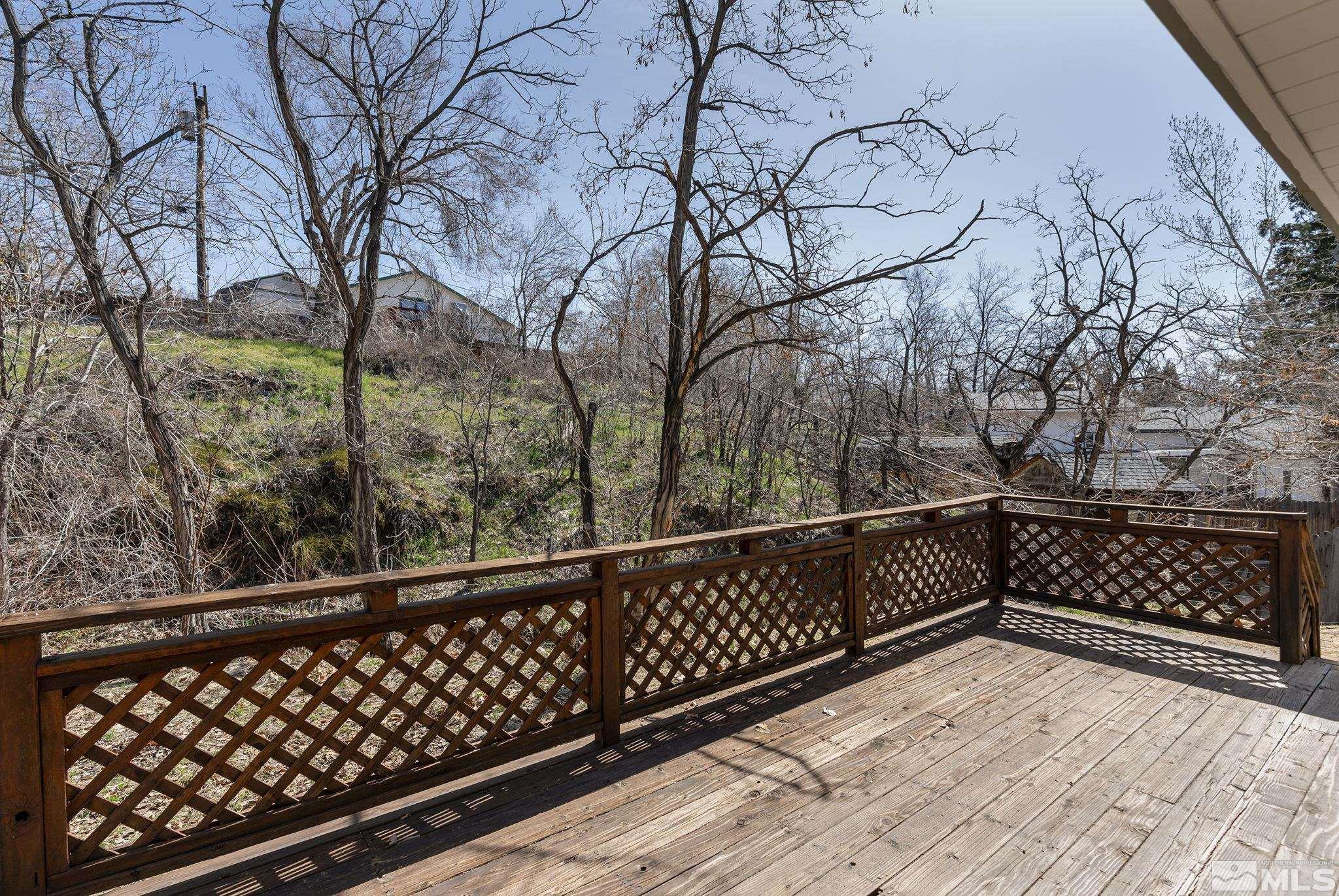 2000 Keystone Avenue Reno, NV 89503 - Photo 17 of 19 a view of a balcony with wooden fence and trees