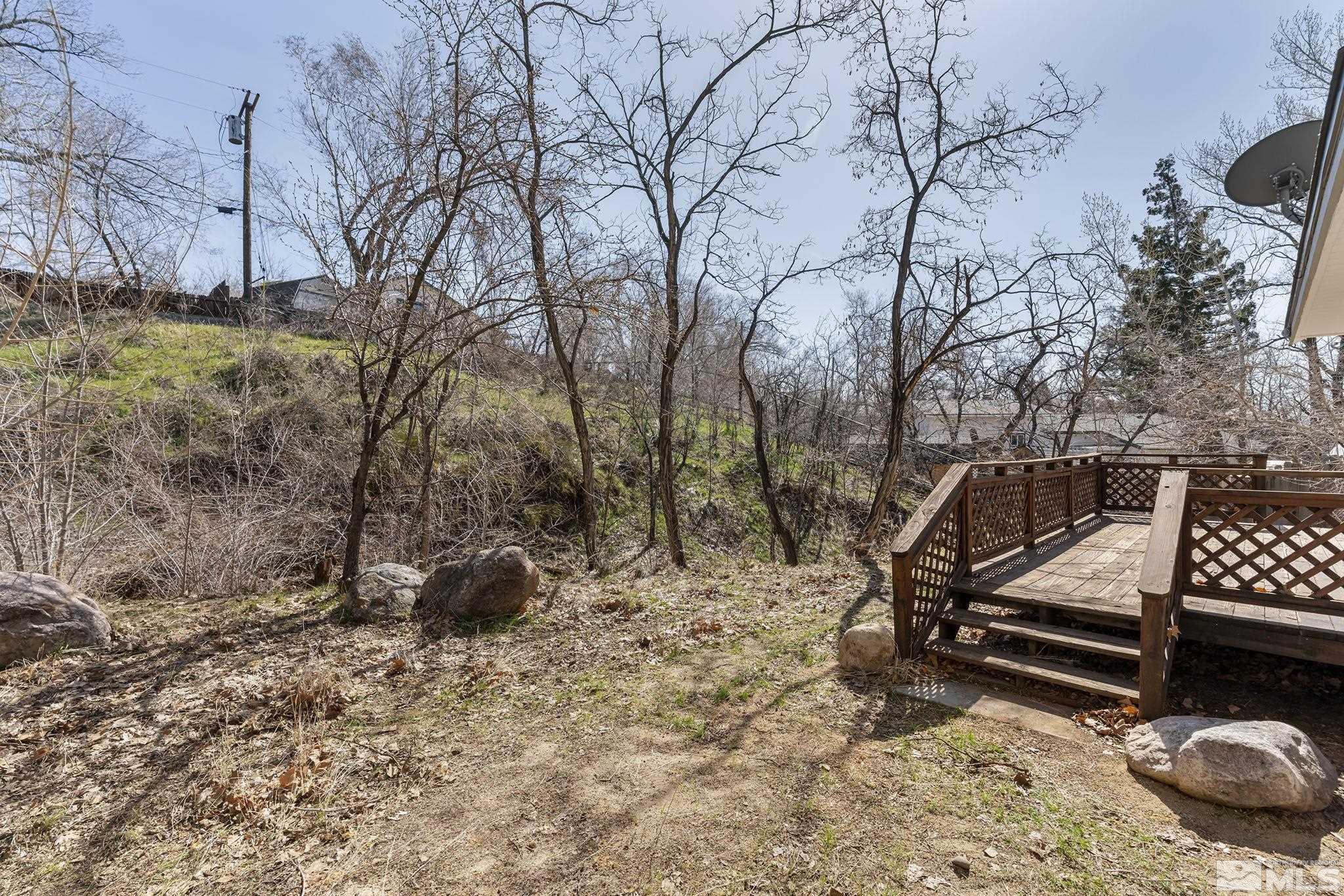 2000 Keystone Avenue Reno, NV 89503 - Photo 18 of 19 a view of backyard with wooden fence and trees