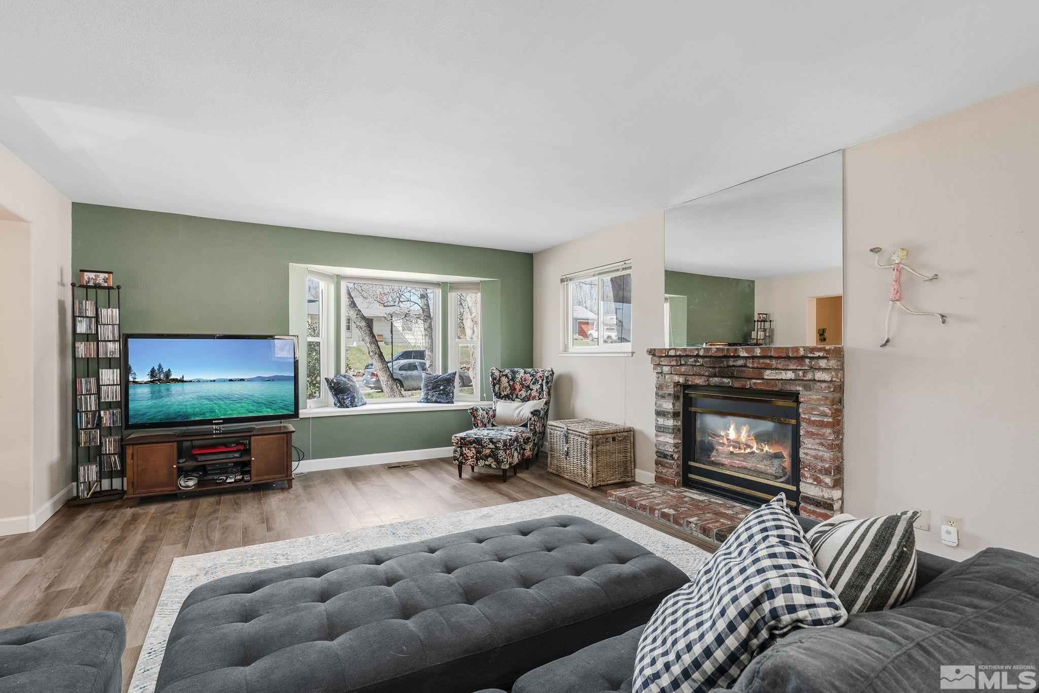 2000 Keystone Avenue Reno, NV 89503 - Photo 3 of 19 a living room with furniture and a flat screen tv