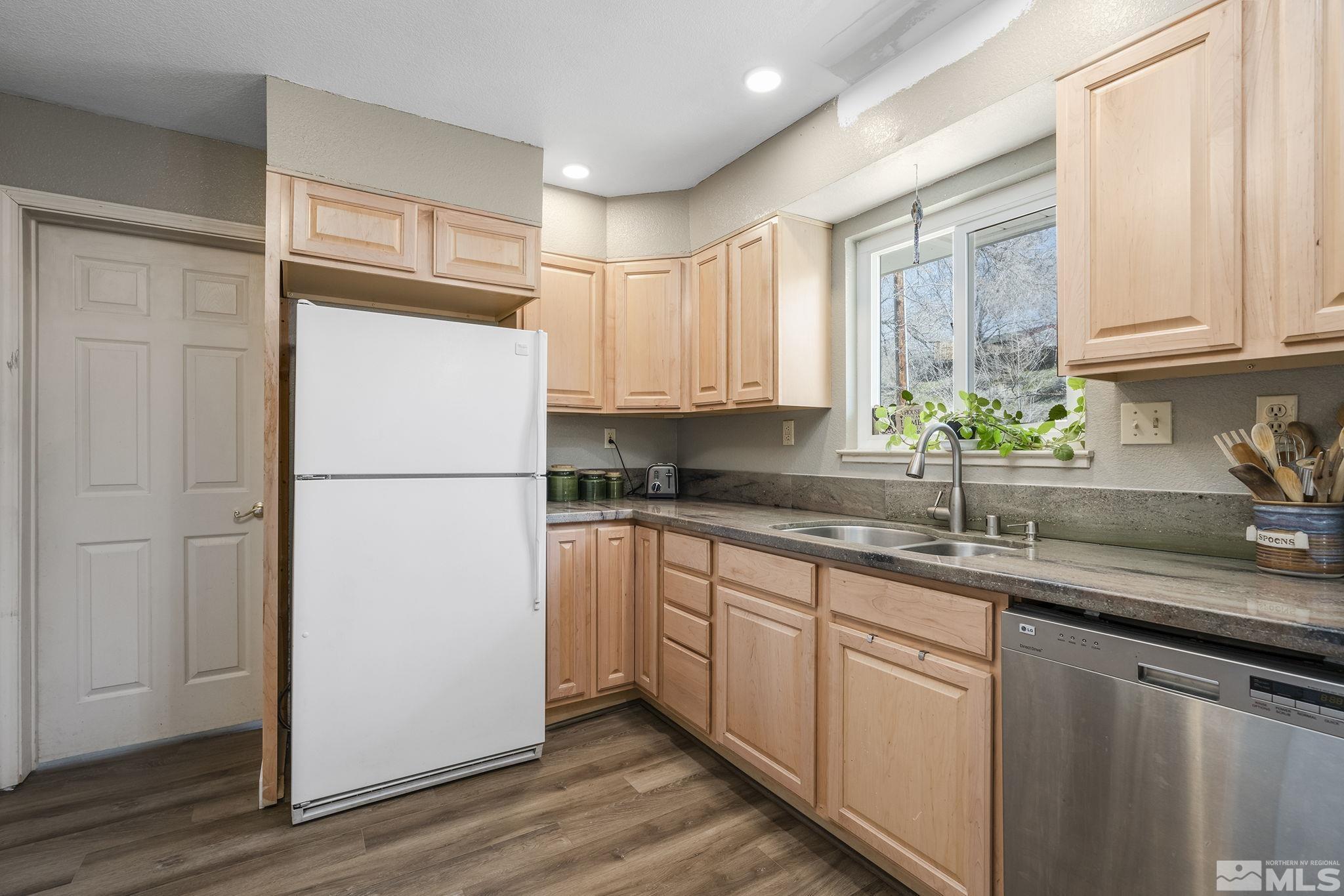 2000 Keystone Avenue Reno, NV 89503 - Photo 9 of 19 a kitchen with appliances cabinets and a sink