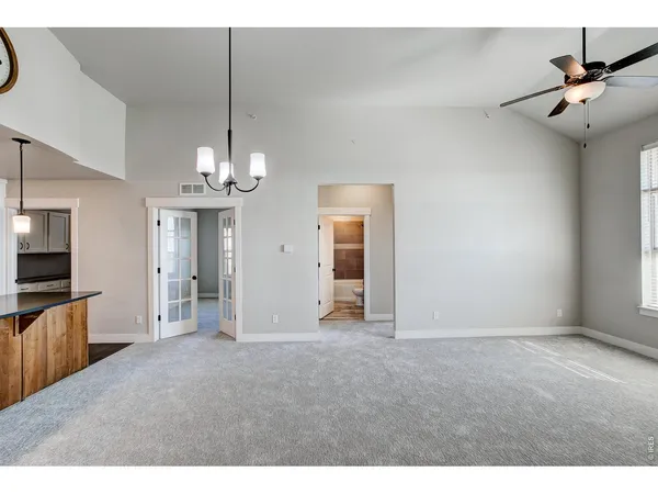 a large kitchen with cabinets and a fireplace