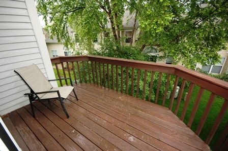 1080 Stillwater Road, Unit 1080 Elgin, IL 60120 - Photo 11 of 11 a view of balcony with wooden floor and bench
