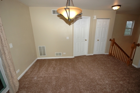 1080 Stillwater Road, Unit 1080 Elgin, IL 60120 - Photo 4 of 11 a view of a hallway to a window