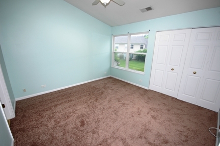 1080 Stillwater Road, Unit 1080 Elgin, IL 60120 - Photo 6 of 11 a view of an empty room with a window