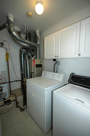 1080 Stillwater Road, Unit 1080 Elgin, IL 60120 - Photo 10 of 11 a view of storage and utility room with washer and dryer