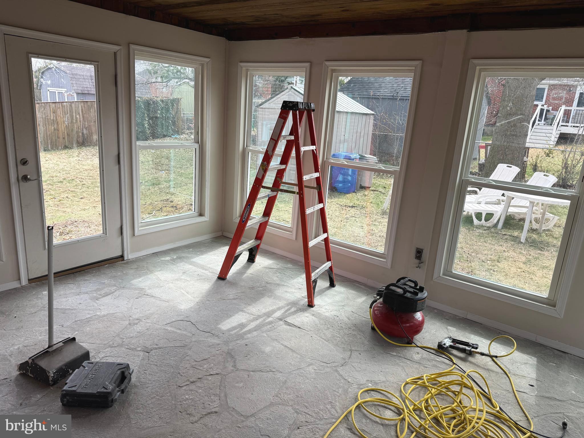 609 Wallerson Road Baltimore, MD 21228 - Photo 4 of 15 a view of a room with gym equipment and floor to ceiling window