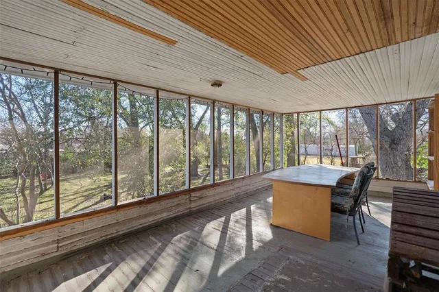 a dining room with furniture window and wooden floor