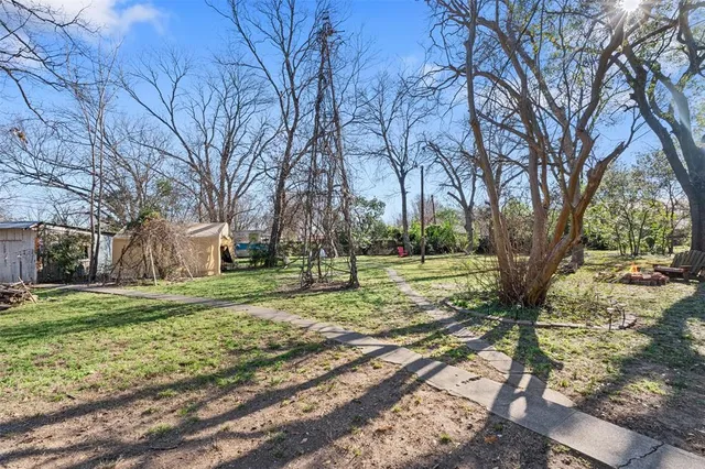 a view of a park with swings and a table