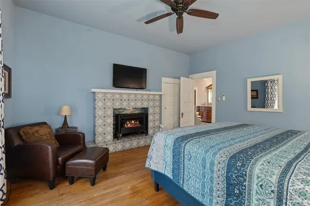 a spacious bedroom with a bed and a couch