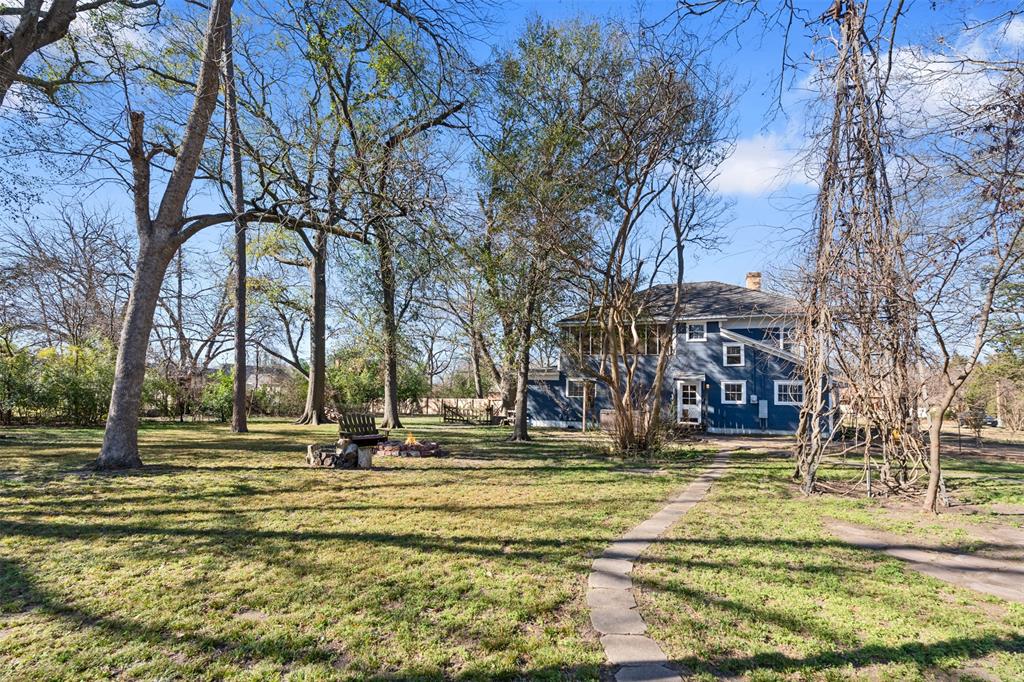 508 North Virginia Street Terrell, TX 75160 - Photo 10 of 40 a garden view with tall buildings