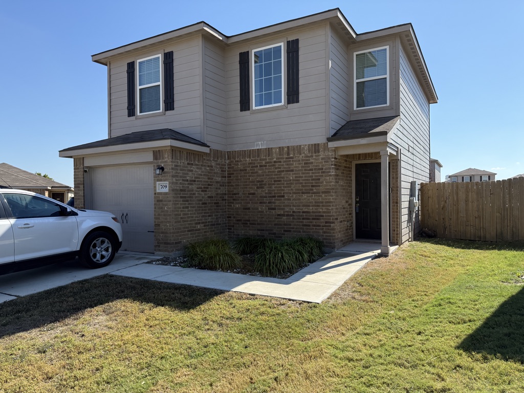 709 Yearwood Lane, Unit 48E Jarrell, TX 76537 - Photo 1 of 39 a view of a house with a yard