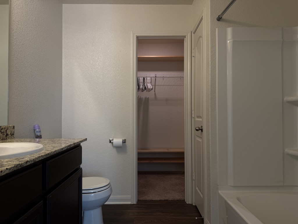 709 Yearwood Lane, Unit 48E Jarrell, TX 76537 - Photo 21 of 39 a bathroom with a sink toilet and vanity