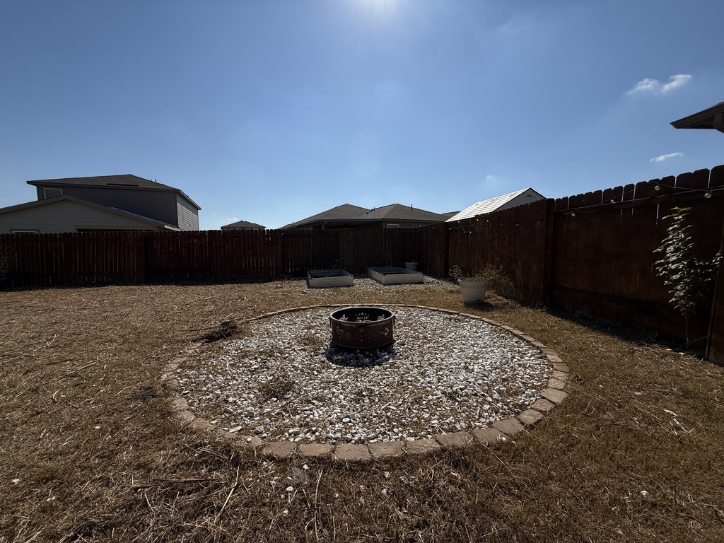 709 Yearwood Lane, Unit 48E Jarrell, TX 76537 - Photo 35 of 39 a view of a house with a yard